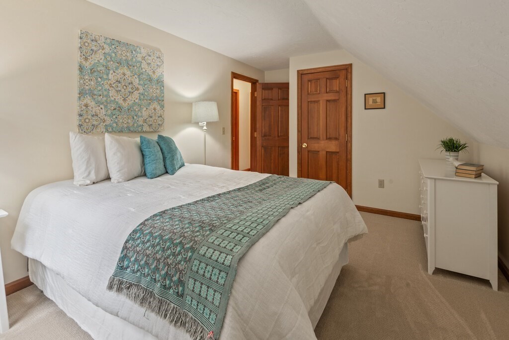 532 B Hubbardston Road Princeton, MA 01541 - Photo 24 of 41 a spacious bedroom with a bed and a lamp