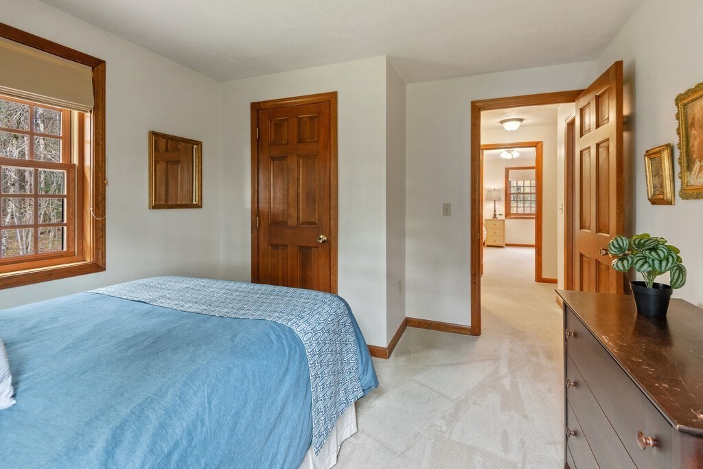 532 B Hubbardston Road Princeton, MA 01541 - Photo 26 of 41 a spacious bedroom with a large bed and potted plant