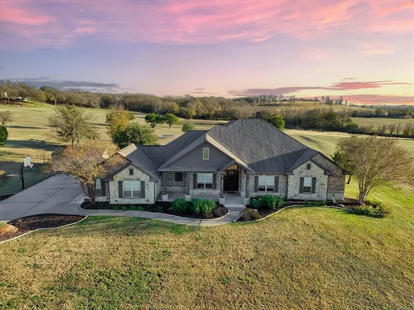 a house with trees in the background