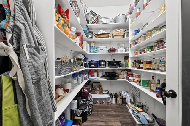 a kitchen with stainless steel appliances granite countertop a sink and a stove