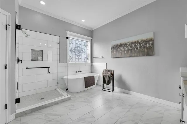 a living room with flat screen tv and kitchen view