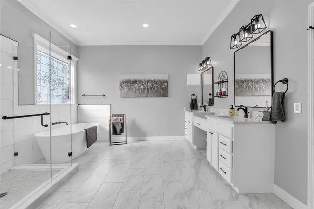 a spacious bathroom with a bathtub and a shower