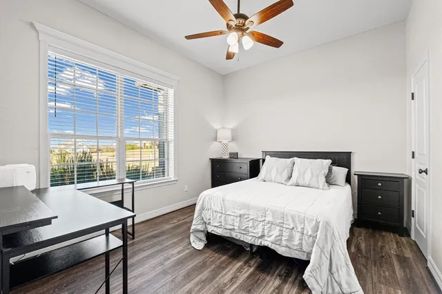 a bathroom with a double vanity sink a mirror and a bathtub