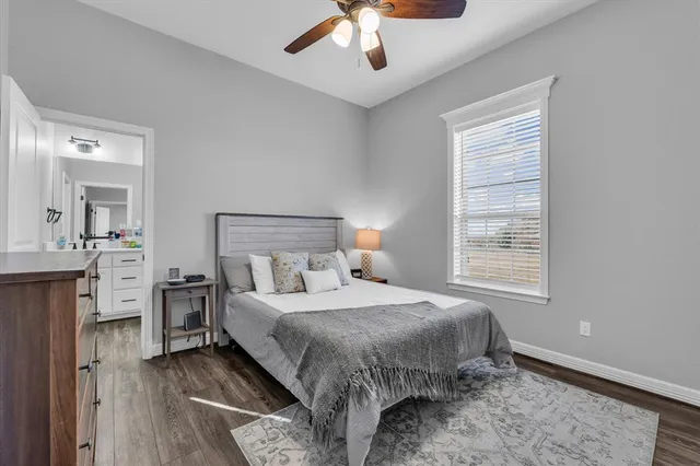 a bathroom with a toilet sink and shower