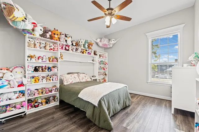 a bathroom with a double vanity sink a mirror a bathtub and shower