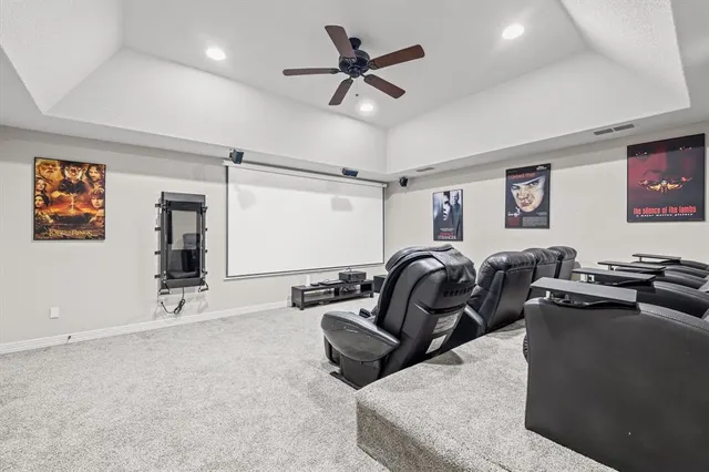 a hallway with white cabinets and wooden floor