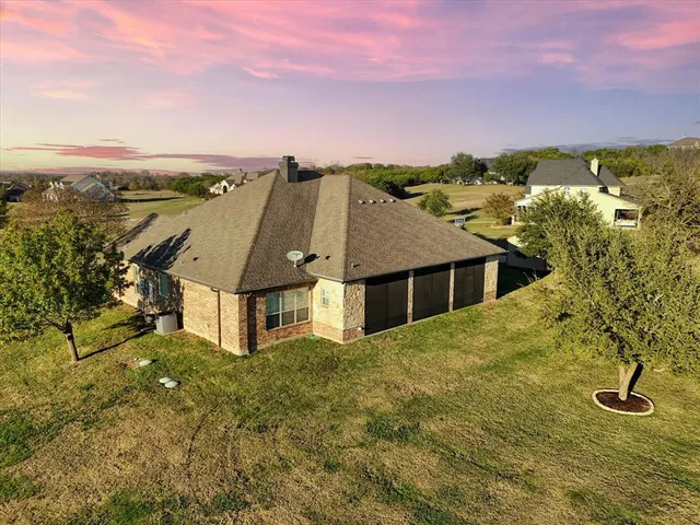 a house with swimming pool in front of it