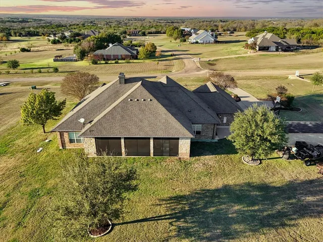 an aerial view of a house with a ocean view