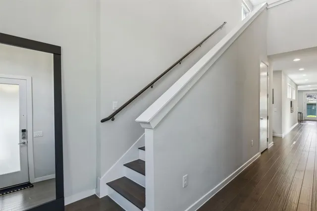 a view of entryway with wooden floor