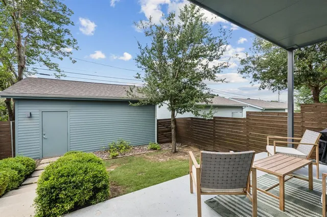 a backyard of a house with seating space