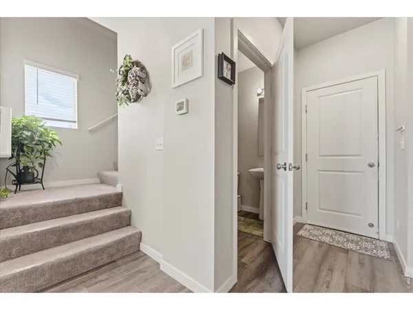 a bathroom with a sink mirror and toilet