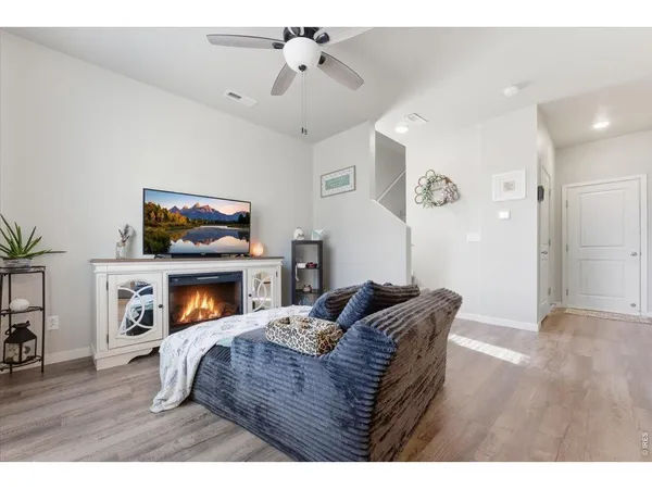 a bedroom with furniture and a fireplace