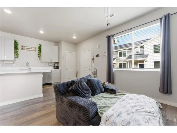 a bedroom with a bed and flat screen tv