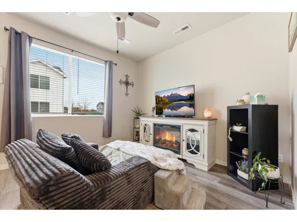 a kitchen with stainless steel appliances kitchen island granite countertop a stove a sink and a refrigerator