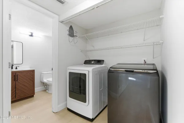 a utility room with dryer and washer