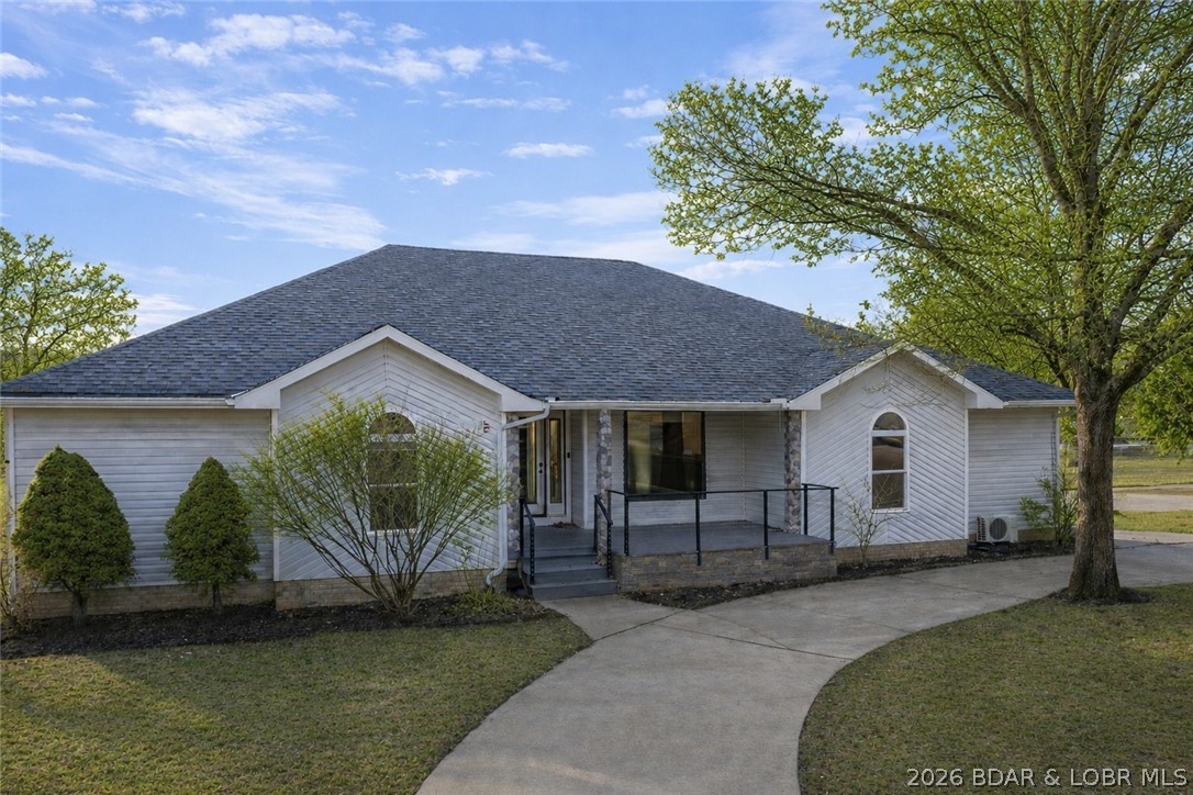 46 Watkins Road Camdenton, MO 65020 - Photo 2 of 50 Flat circle driveway at front entry.
AI generated