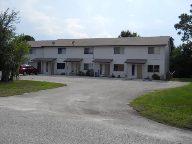 a view of house with outdoor space and tree s