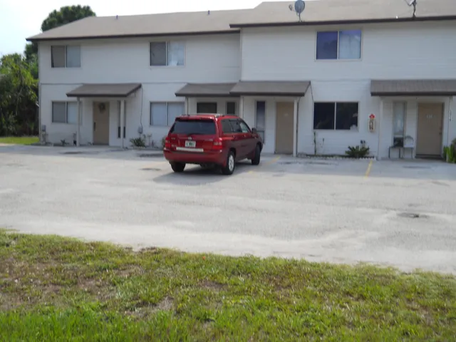 a car parked in front of garage