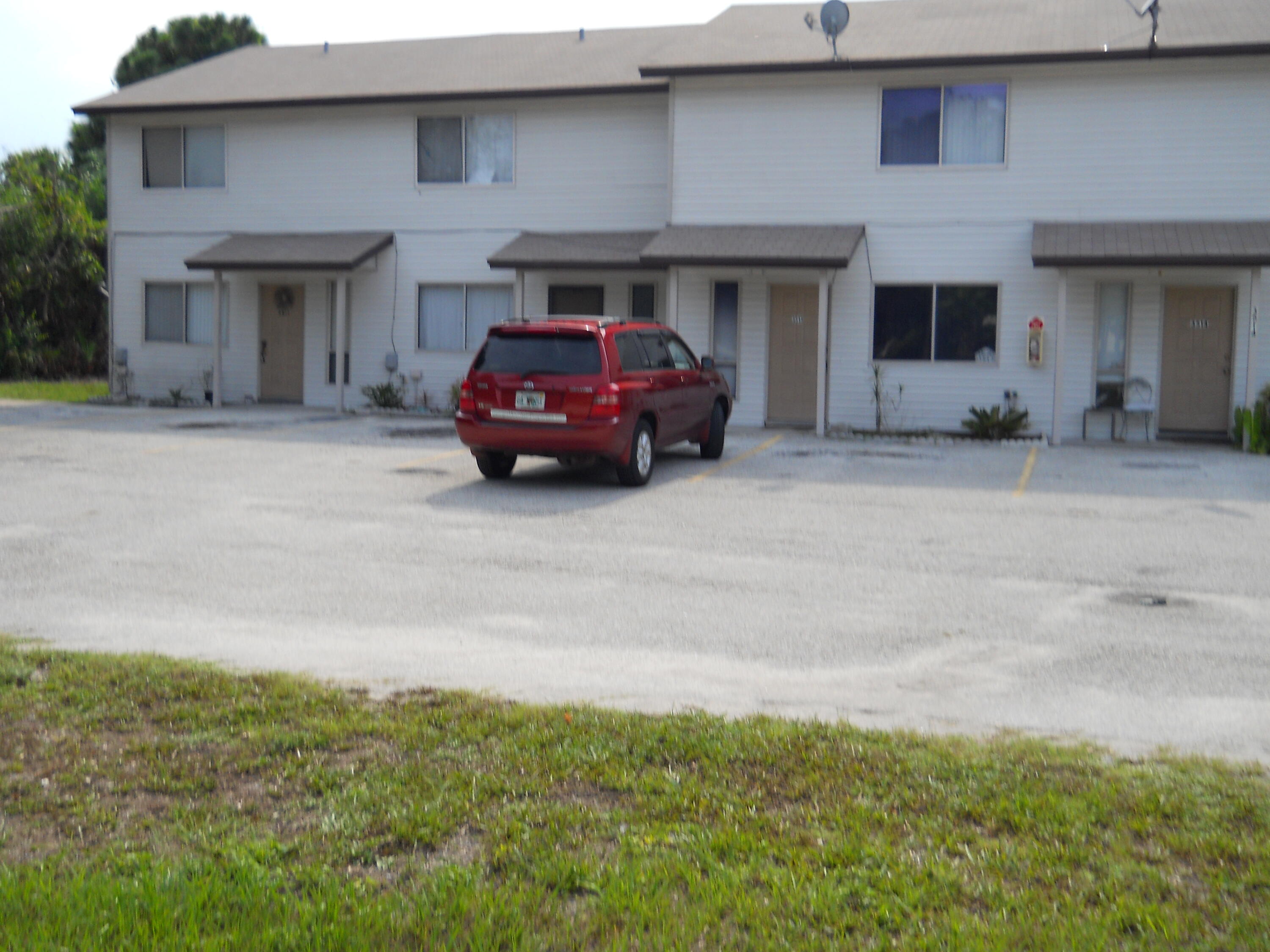 3513 Tree Ridge Lane Northeast Palm Bay, FL 32905 - Photo 6 of 16 a car parked in front of garage