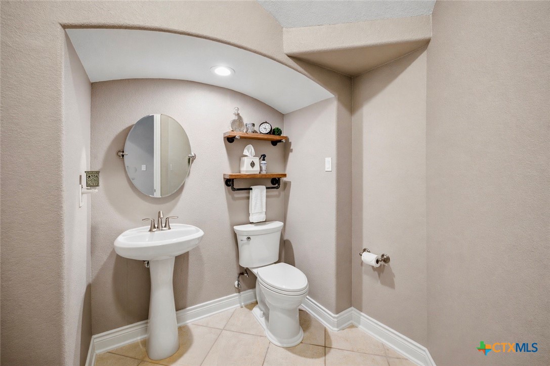 2427 Anderson Point Lane Spring, TX 77388 - Photo 11 of 47 a bathroom with a toilet sink and mirror