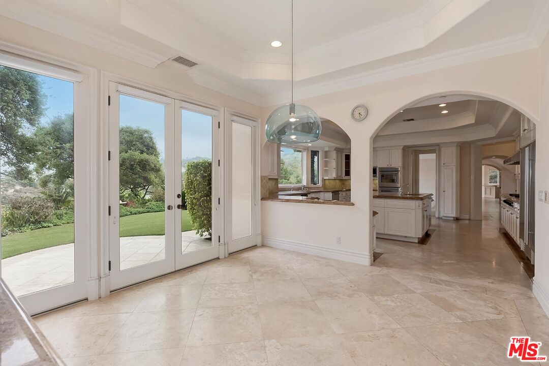 11971 Lockridge Road Studio City, CA 91604 - Photo 14 of 31 a view of a big room with windows and chandelier