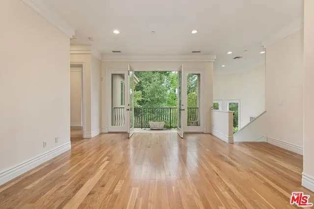 a view of a hallway with a living room