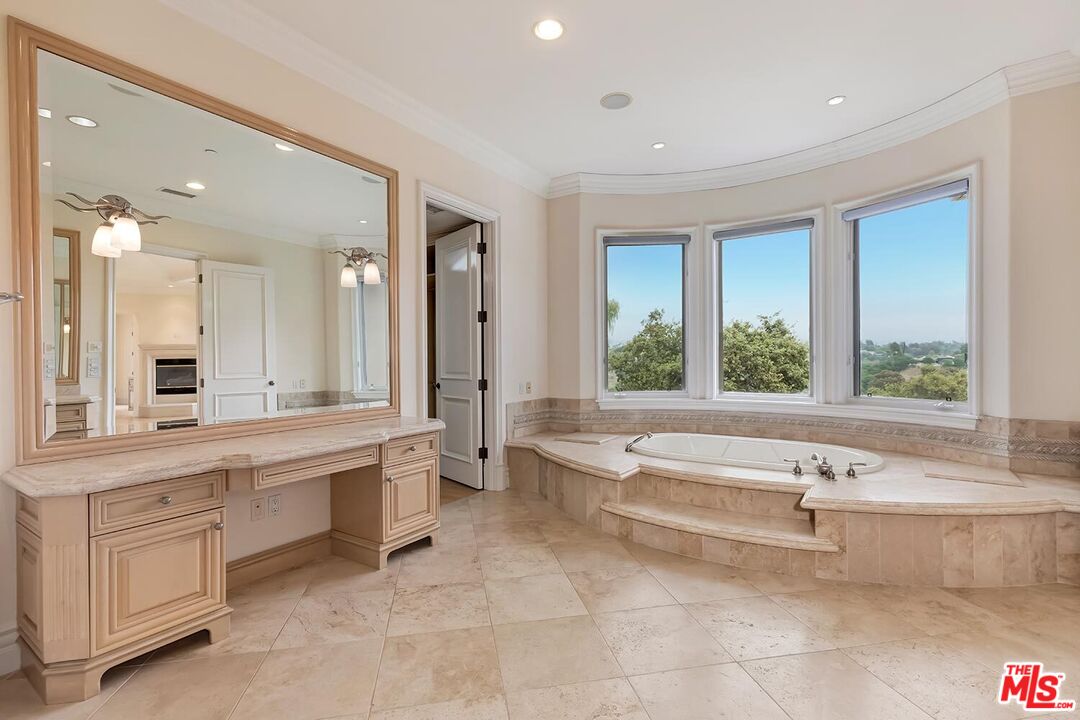 11971 Lockridge Road Studio City, CA 91604 - Photo 20 of 31 a spacious bathroom with a large tub shower and sink