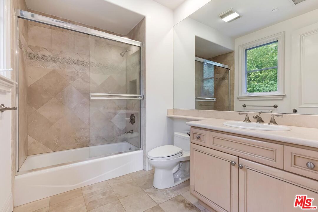 11971 Lockridge Road Studio City, CA 91604 - Photo 25 of 31 a bathroom with a granite countertop sink toilet and shower
