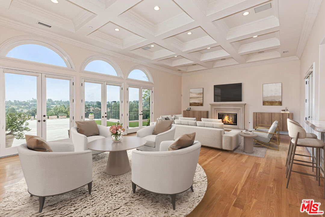 11971 Lockridge Road Studio City, CA 91604 - Photo 7 of 31 a living room with furniture and a flat screen tv