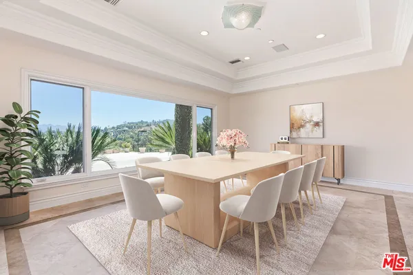 a kitchen with sink a window and cabinets