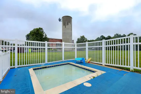 a view of a balcony with yard