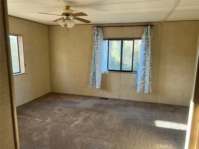 a swimming pool view with a seating space