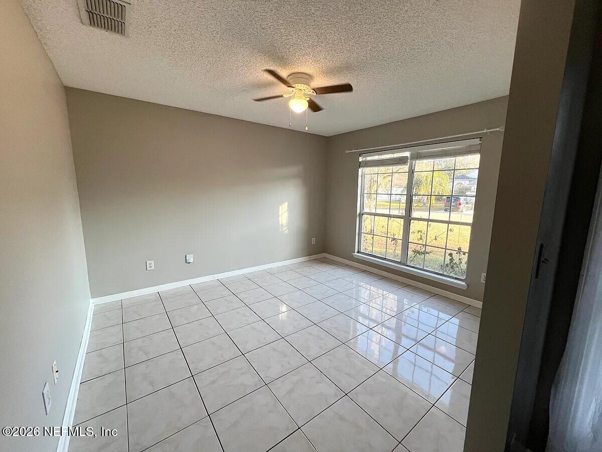 913 Mackinaw Trail St. Augustine, FL 32092 - Photo 29 of 65 a view of an empty room with a window