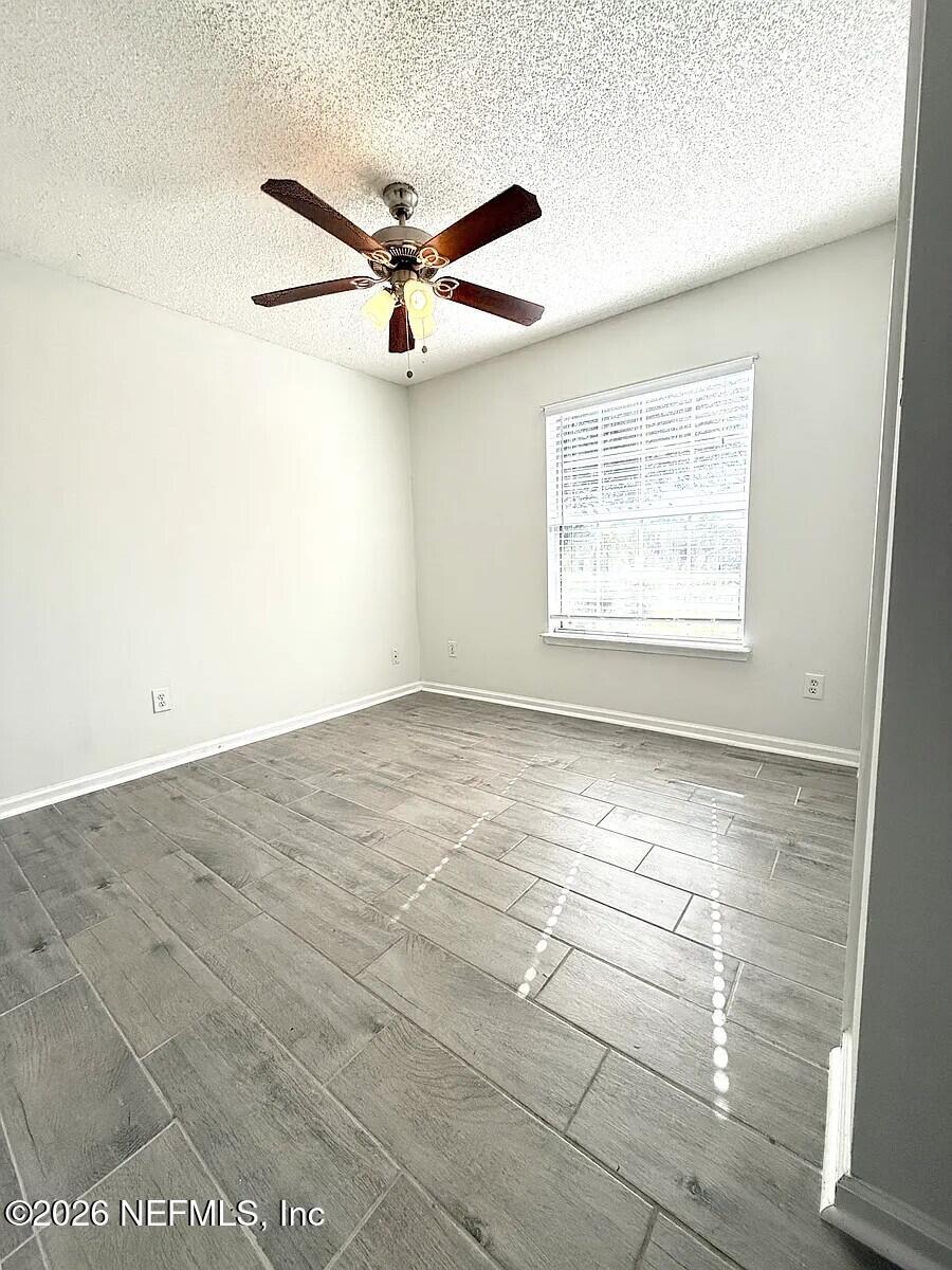 913 Mackinaw Trail St. Augustine, FL 32092 - Photo 42 of 65 a view of an empty room with a window