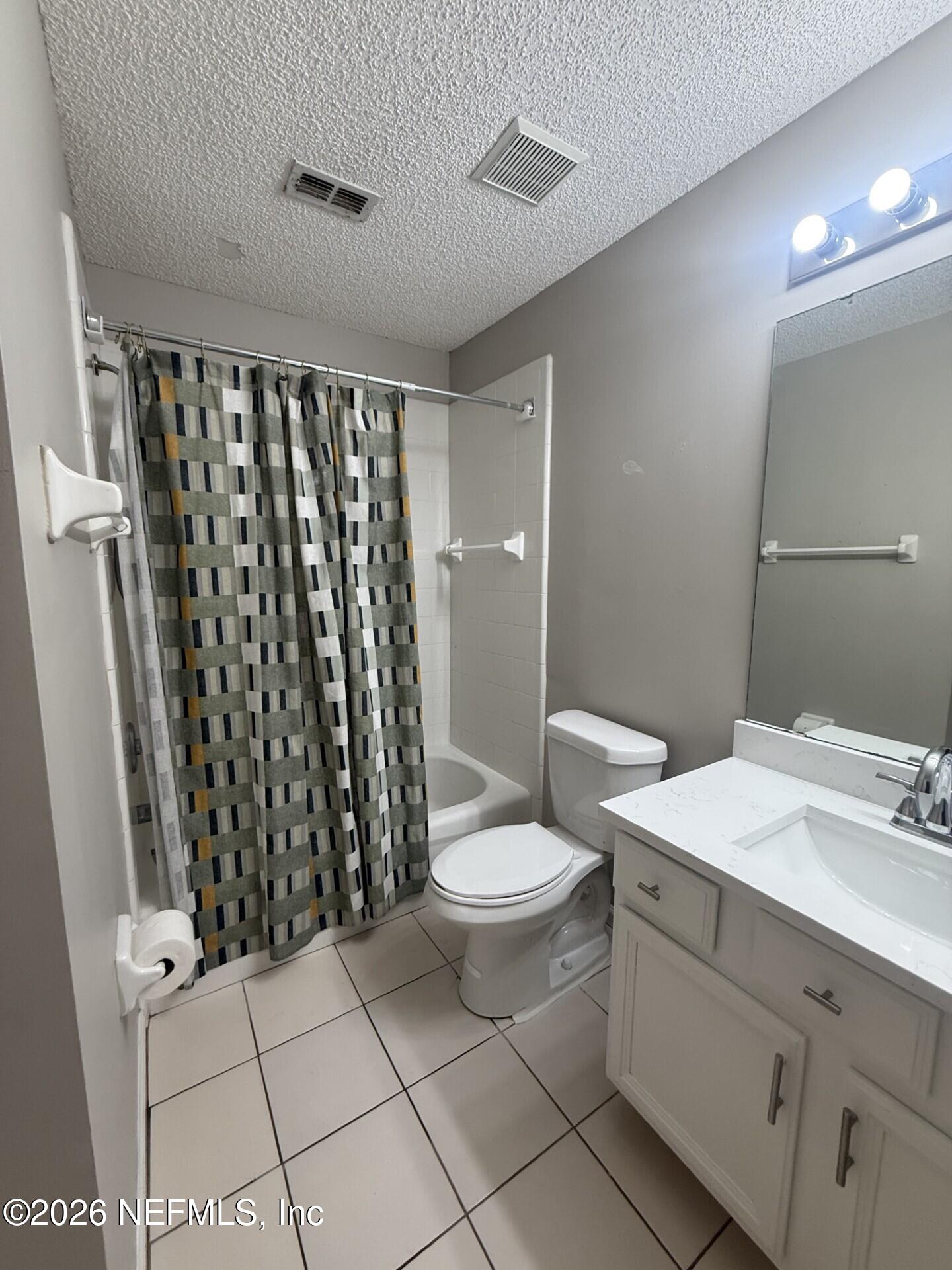 913 Mackinaw Trail St. Augustine, FL 32092 - Photo 44 of 65 a bathroom with a sink toilet and shower