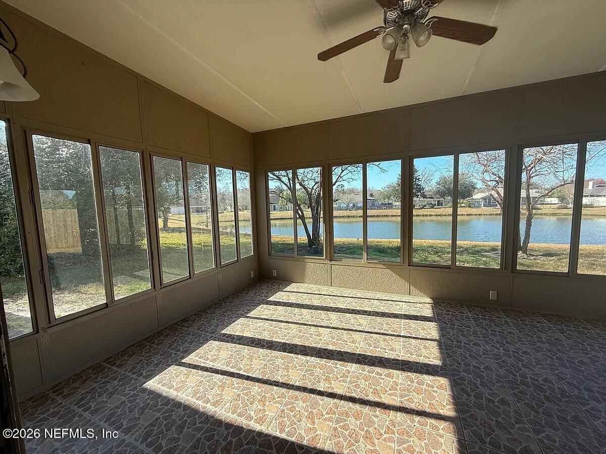 913 Mackinaw Trail St. Augustine, FL 32092 - Photo 58 of 65 a spacious bedroom with a large bed and a large window