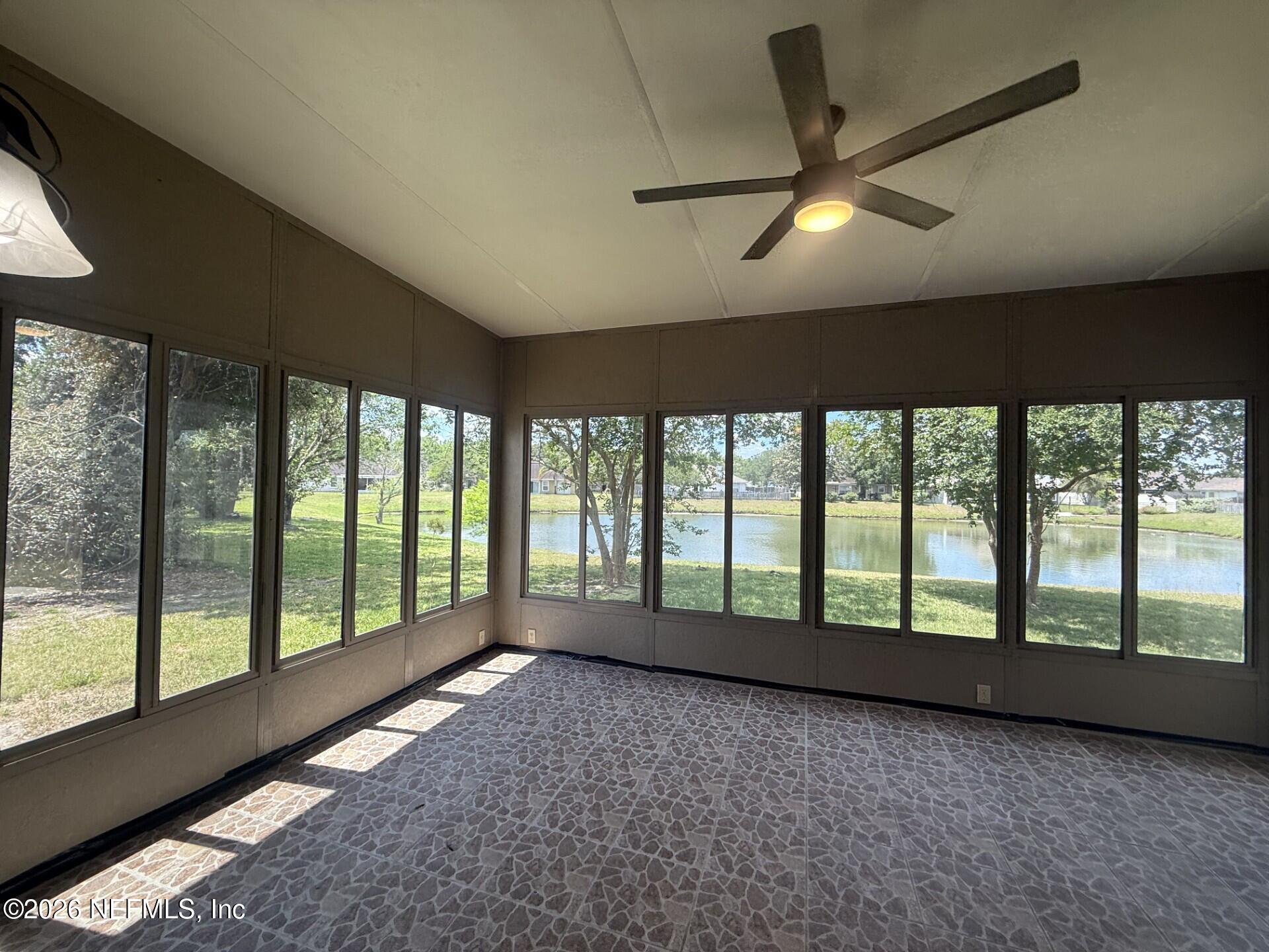 913 Mackinaw Trail St. Augustine, FL 32092 - Photo 62 of 65 a view of an empty room with a large window