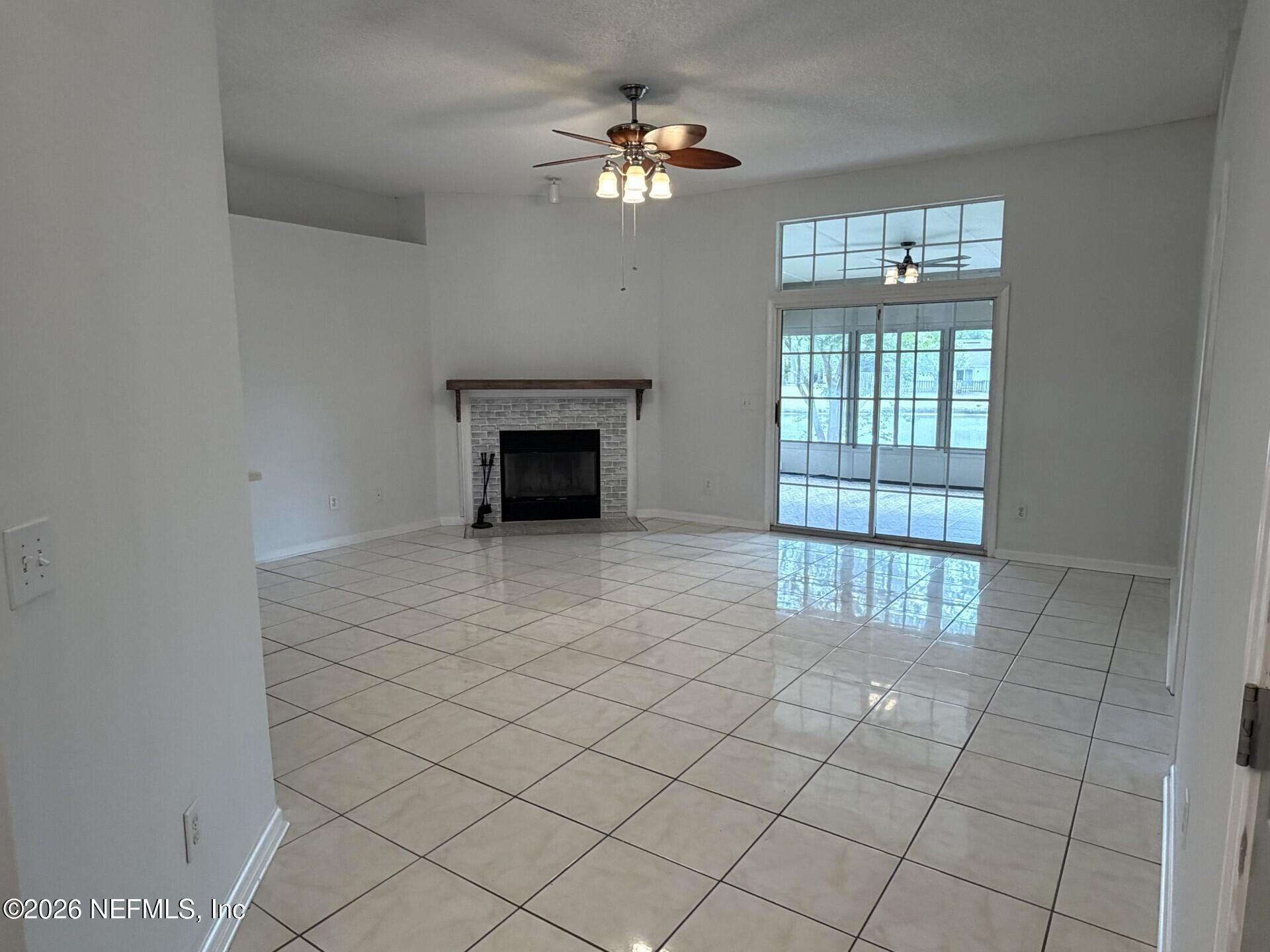 913 Mackinaw Trail St. Augustine, FL 32092 - Photo 7 of 65 a view of an empty room with a fireplace