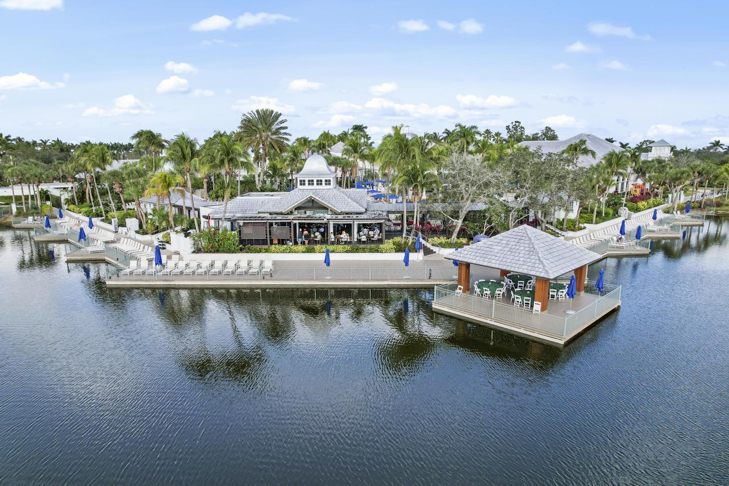 9213 Museo Circle, Unit 103 Naples, FL 34114 - Photo 44 of 47 a view of a lake with houses