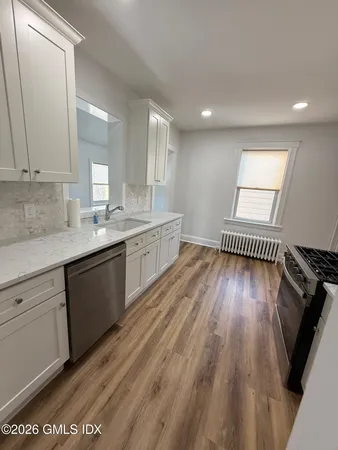 a view of a kitchen from the hallway