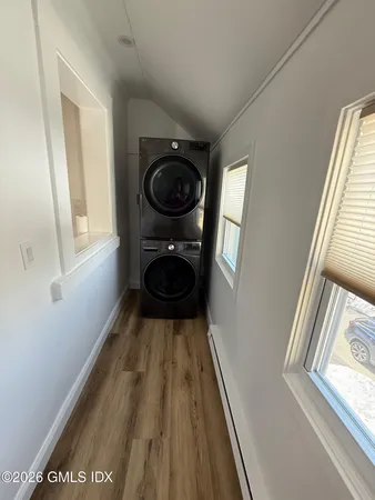a view of a hallway with washer and dryer