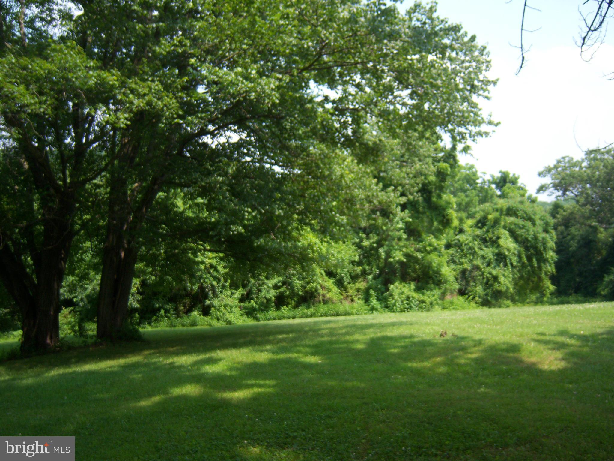 Indian Spring Sparks, MD 21152 - Photo 2 of 9 a view of field with trees in the background