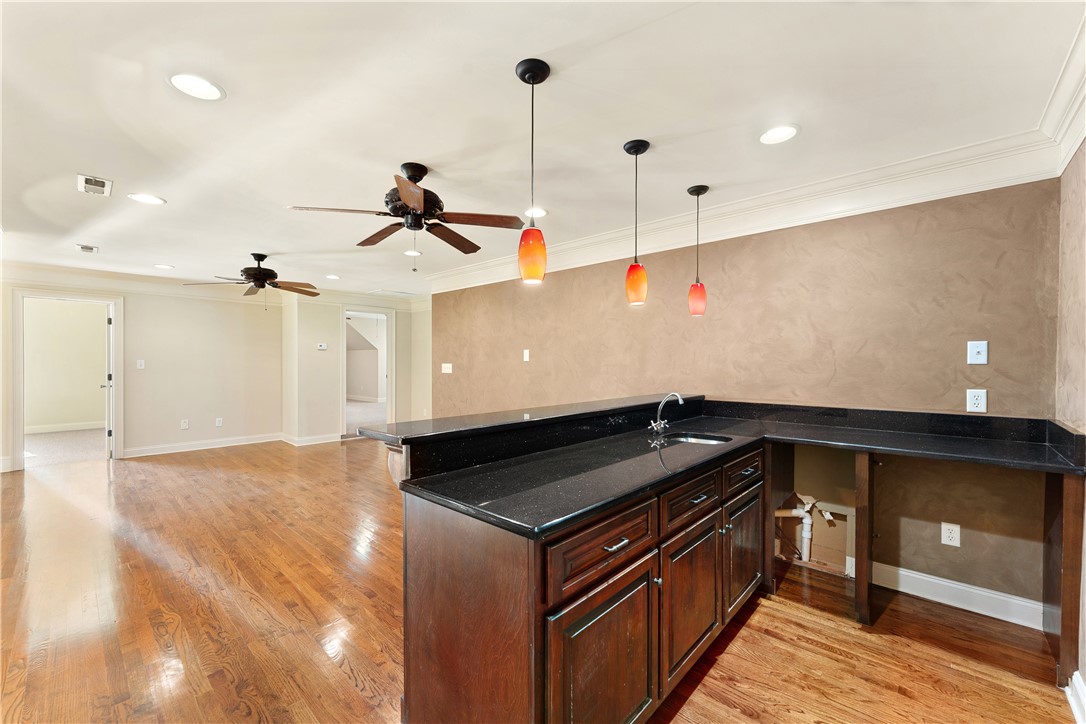 109 Limelight Drive Anderson, SC 29621 - Photo 23 of 34 This versatile basement features a functional bar and rich hardwood flooring throughout.