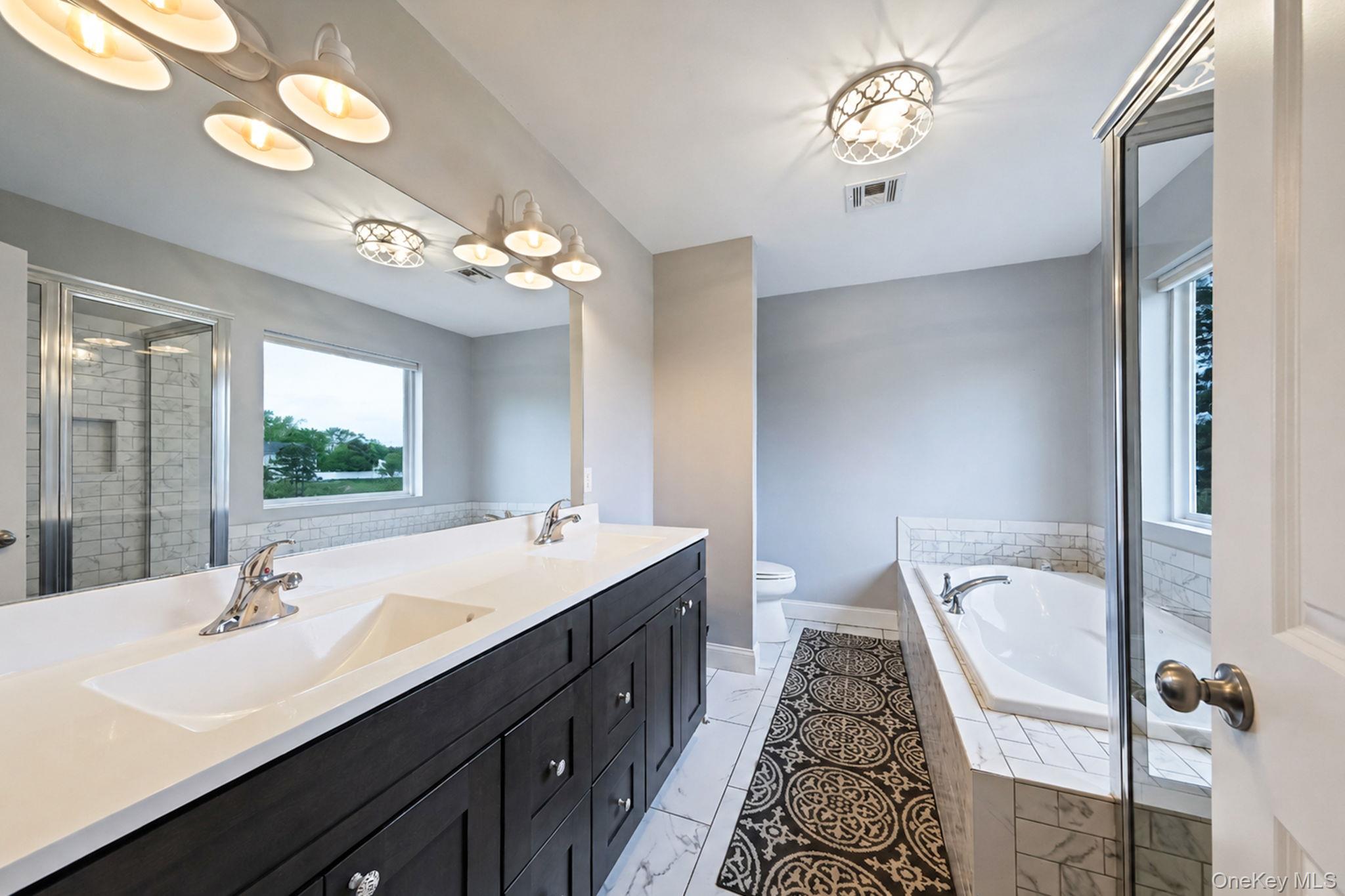 86 Country Road Medford, NY 11763 - Photo 28 of 47 Primary En-Suite Bathroom with Dual Vanity, Walk In Shower, Separate Tub