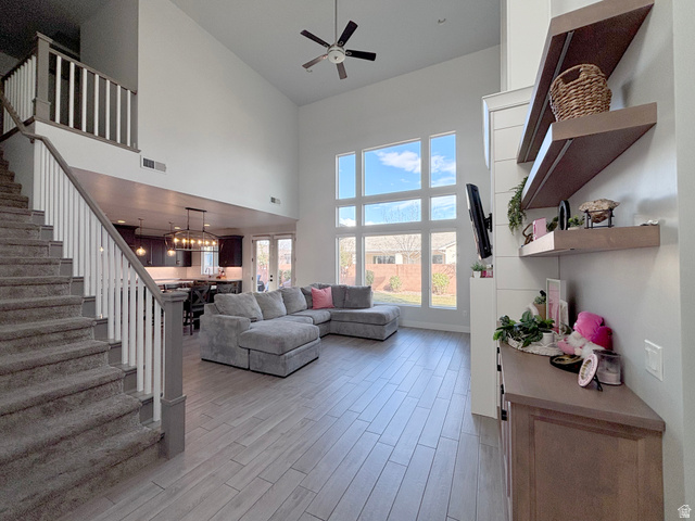 429 East Treasure Road Washington, UT 84780 - Photo 5 of 36 Living area with light wood-type flooring, a ceiling fan, and vaulted ceiling