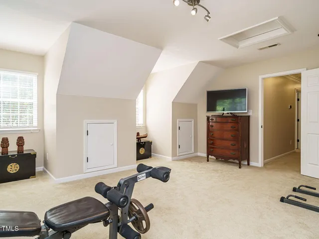 a view of a backyard with a garden and trees