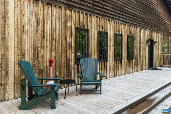 a view of a room with lots of wooden furniture