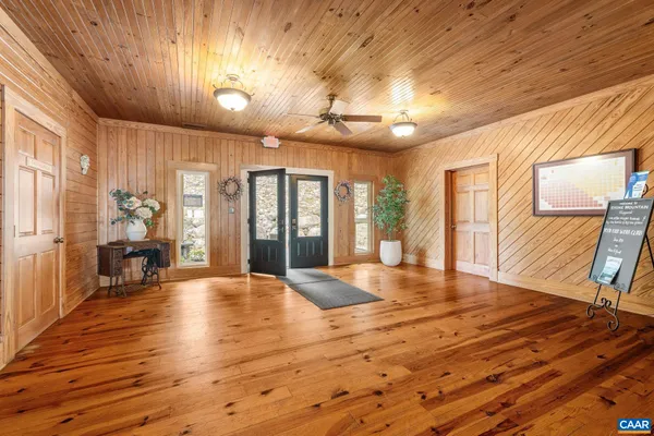 a view of swimming pool with a chairs