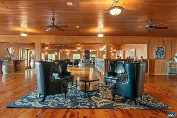 a view of a hall with wooden floor