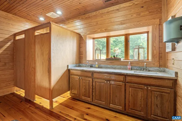 a living room with furniture and a kitchen